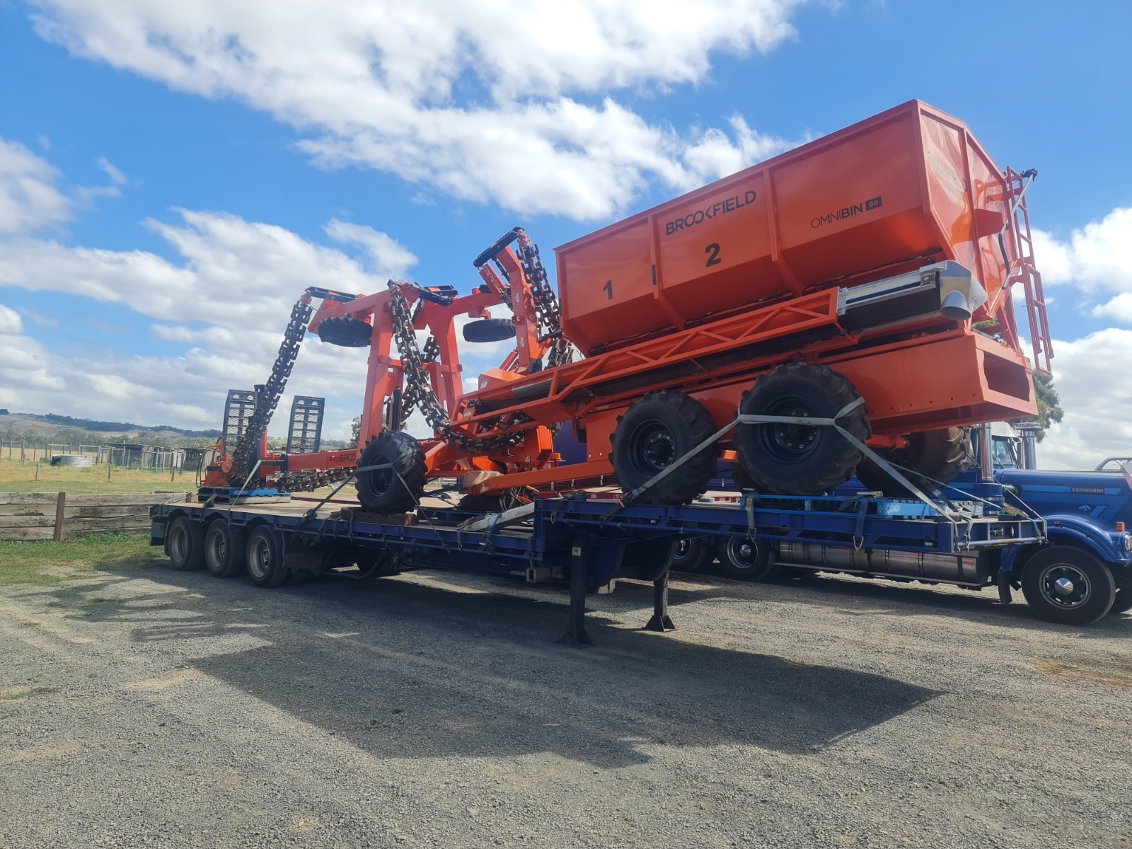 Brookfield Omnibin agricultural equipment on low loader