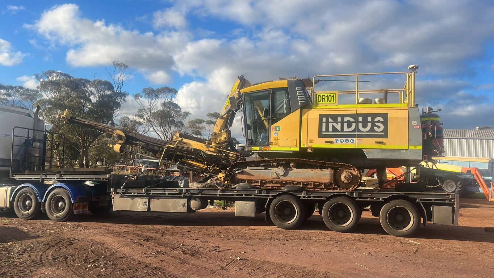 INDUS DR101 excavator on flatbed trailer