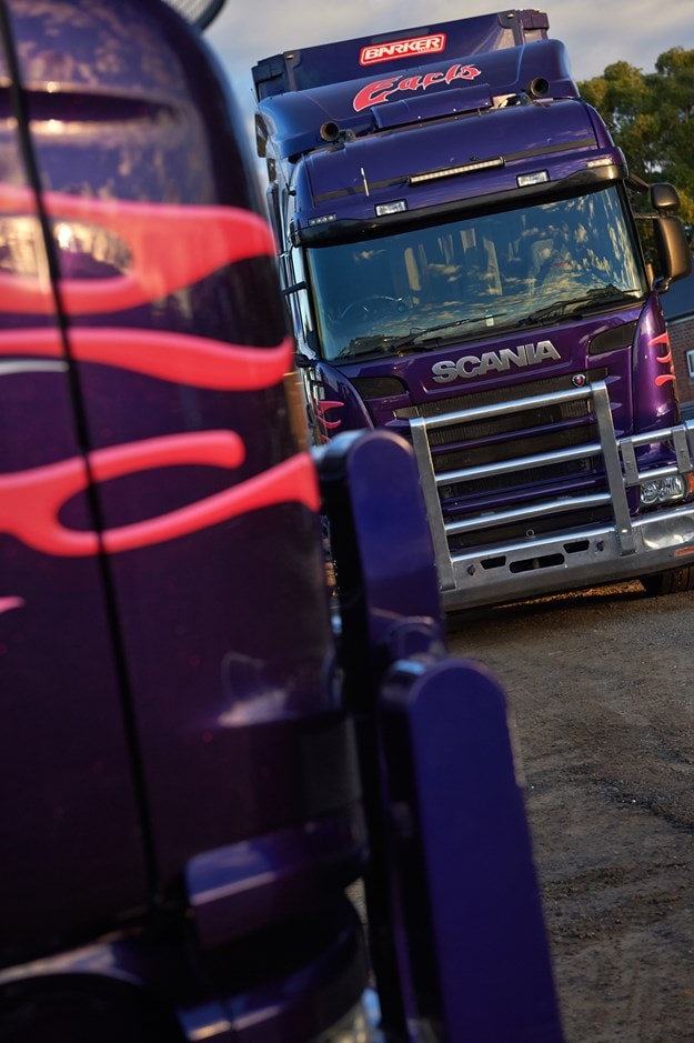 Purple Earls Heavy Haulage Scania trucks parked together